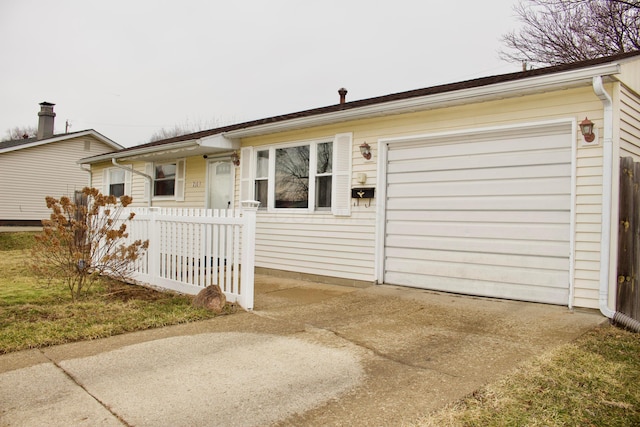 single story home with concrete driveway