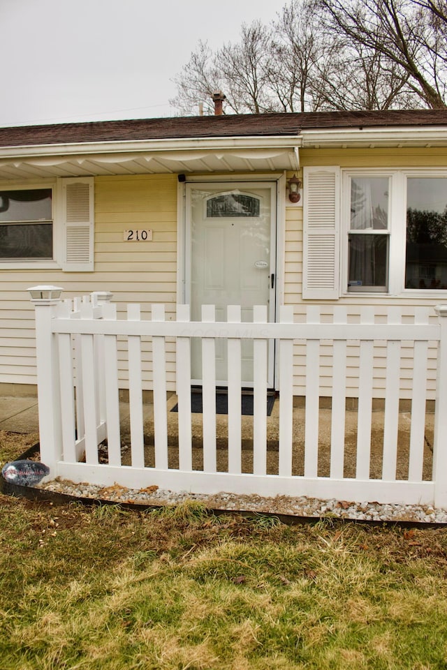 property entrance with a yard