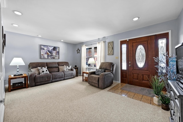 living area featuring recessed lighting, baseboards, and light colored carpet