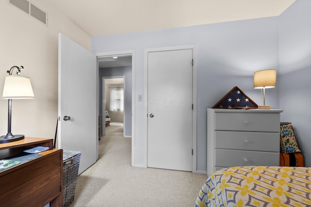 bedroom featuring visible vents and baseboards