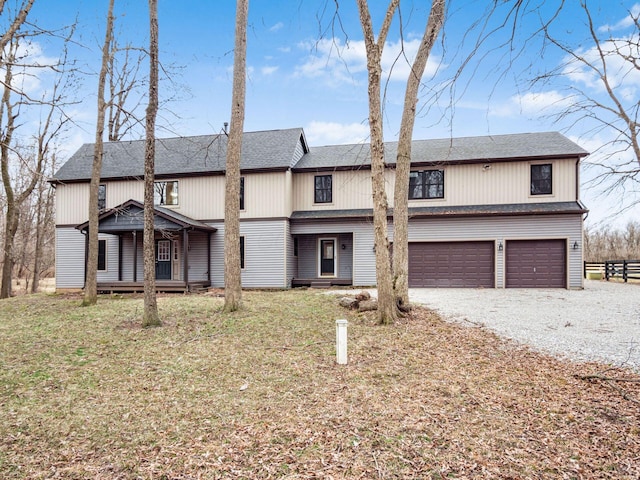 767 London Groveport Rd, Lockbourne, OH 43137 - view of front of home with driveway, roof with shingles, an attached garage, and fence