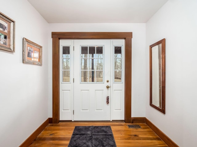 767 London Groveport Rd, Lockbourne, OH 43137 - entryway featuring baseboards, visible vents, and wood finished floors
