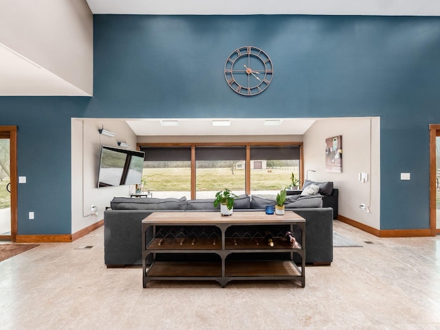 767 London Groveport Rd, Lockbourne, OH 43137 - living area with a high ceiling and baseboards