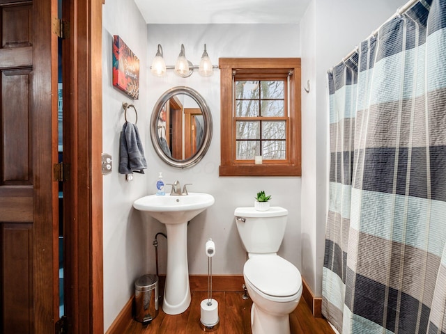 767 London Groveport Rd, Lockbourne, OH 43137 - full bathroom featuring toilet, curtained shower, baseboards, and wood finished floors