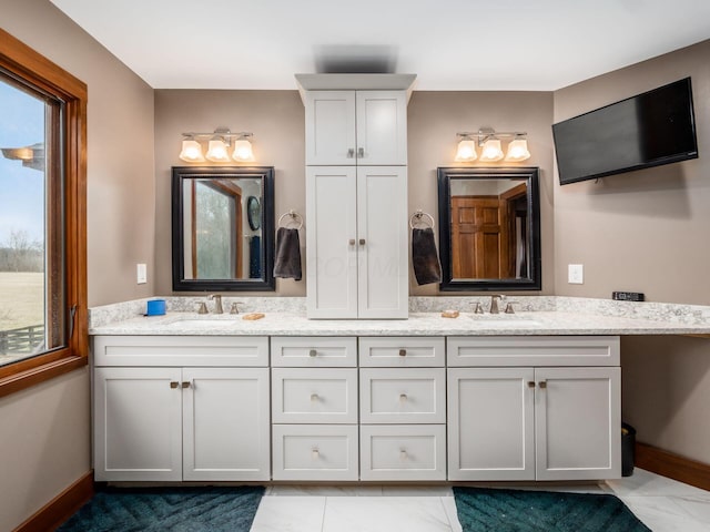 767 London Groveport Rd, Lockbourne, OH 43137 - full bath with a sink, baseboards, and double vanity
