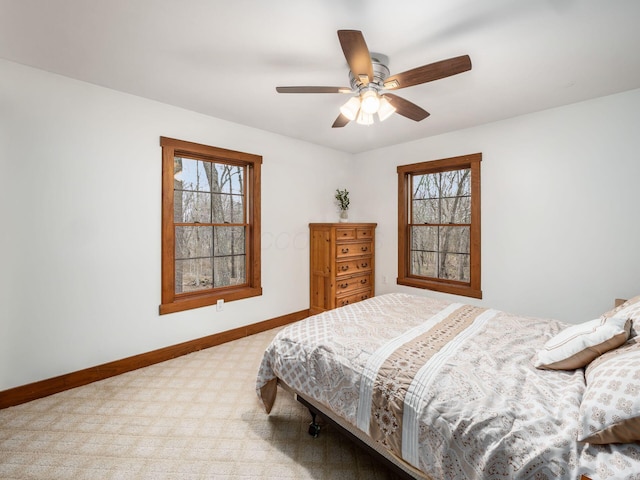 767 London Groveport Rd, Lockbourne, OH 43137 - carpeted bedroom featuring multiple windows, ceiling fan, and baseboards