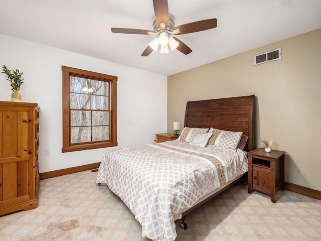767 London Groveport Rd, Lockbourne, OH 43137 - bedroom with light carpet, a ceiling fan, visible vents, and baseboards