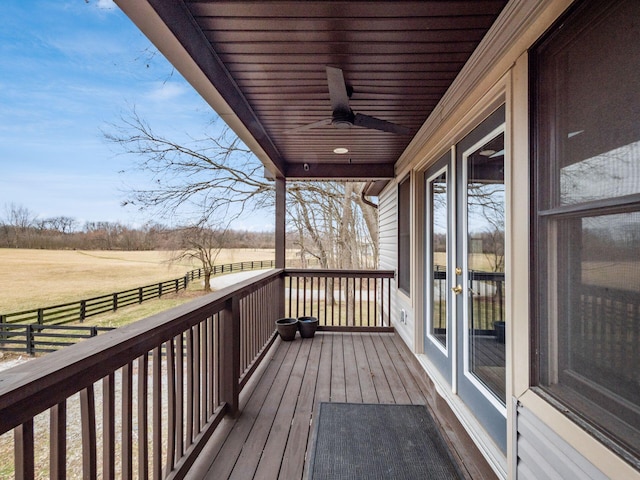 767 London Groveport Rd, Lockbourne, OH 43137 - wooden terrace featuring a rural view, fence, and a ceiling fan