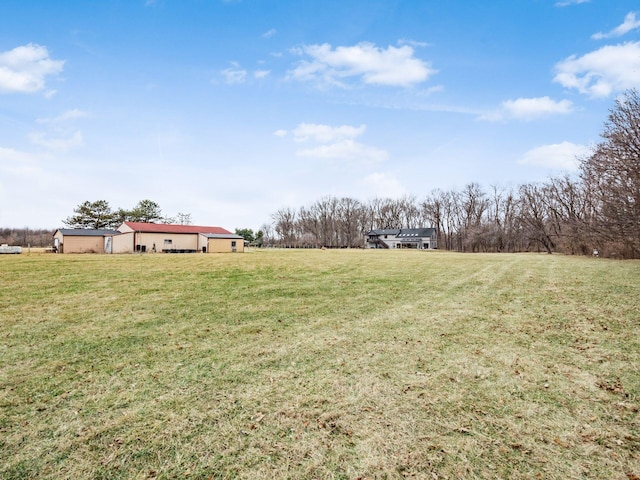 767 London Groveport Rd, Lockbourne, OH 43137 - view of yard featuring a rural view, a pole building, and an outdoor structure