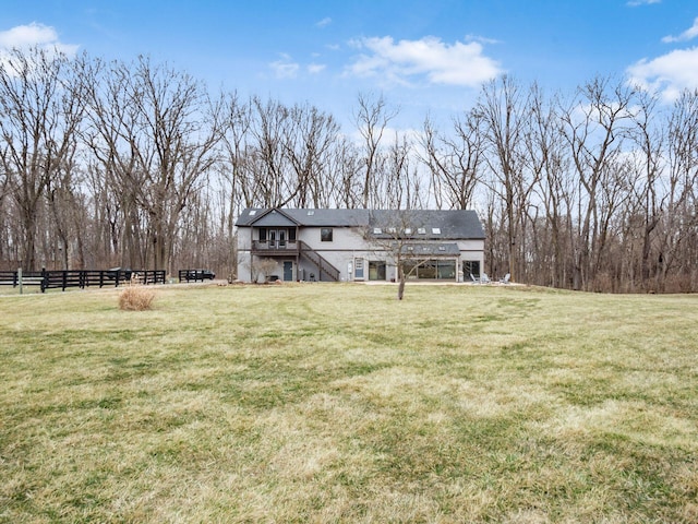 767 London Groveport Rd, Lockbourne, OH 43137 - rear view of property with stairway, fence, and a yard