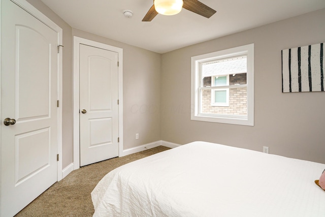 bedroom featuring ceiling fan, carpet floors, and baseboards