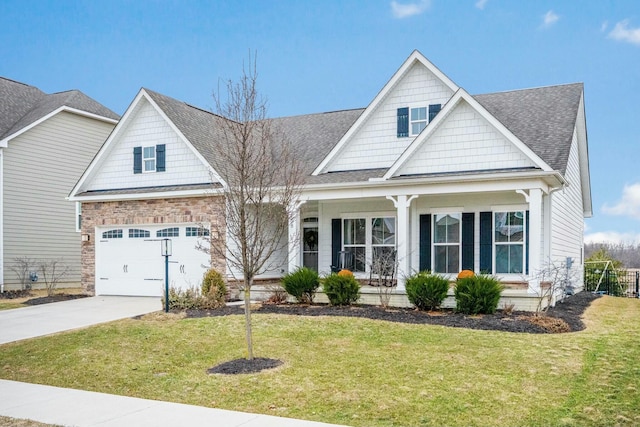 craftsman inspired home featuring a garage, a shingled roof, concrete driveway, covered porch, and a front yard