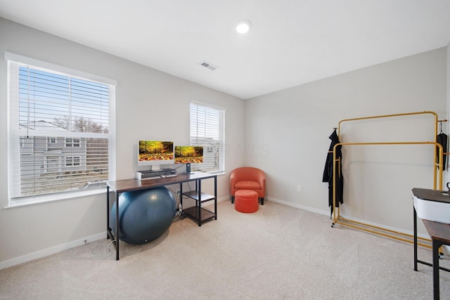 home office with carpet floors, baseboards, and visible vents