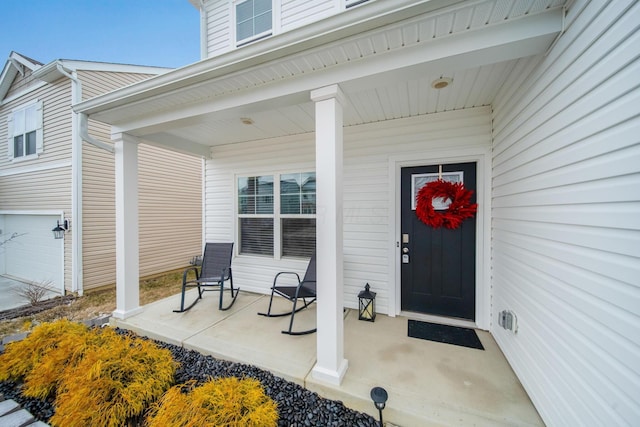 property entrance with covered porch