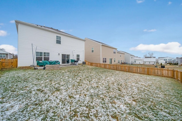 back of property with a patio area, a fenced backyard, and a residential view