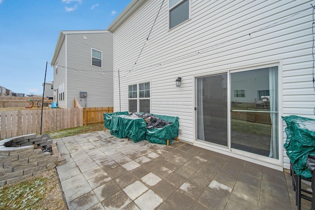 view of patio / terrace featuring fence