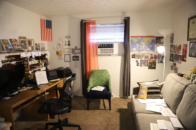 home office featuring cooling unit, a textured ceiling, and carpet