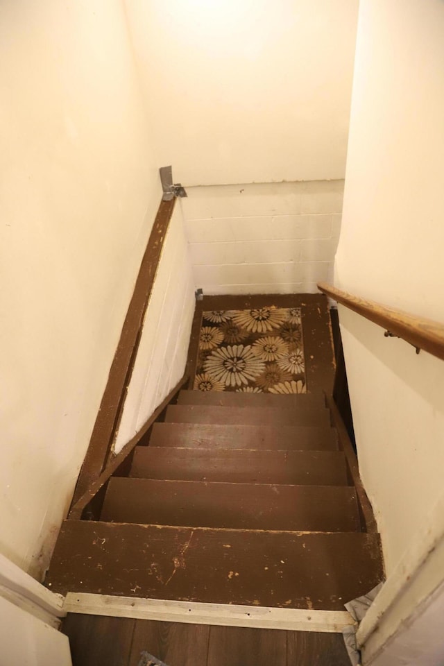 stairway with concrete block wall