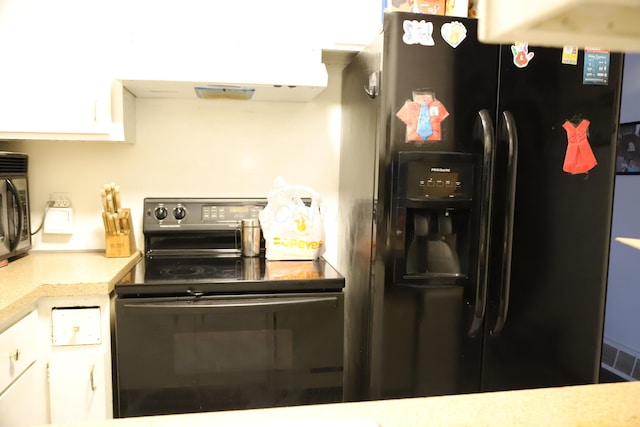 kitchen with white cabinetry, black appliances, light countertops, and under cabinet range hood