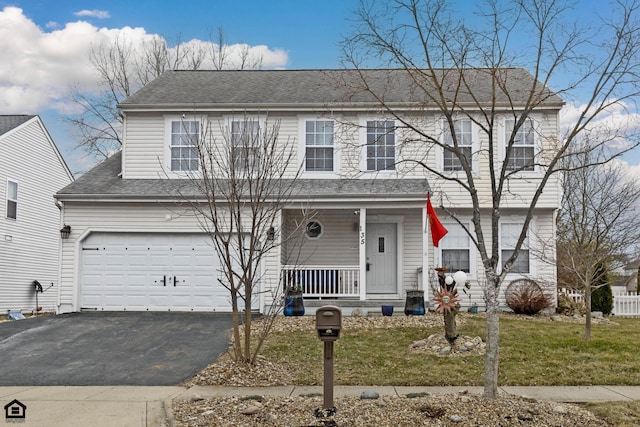 view of front of house featuring a porch, a garage, driveway, roof with shingles, and a front yard