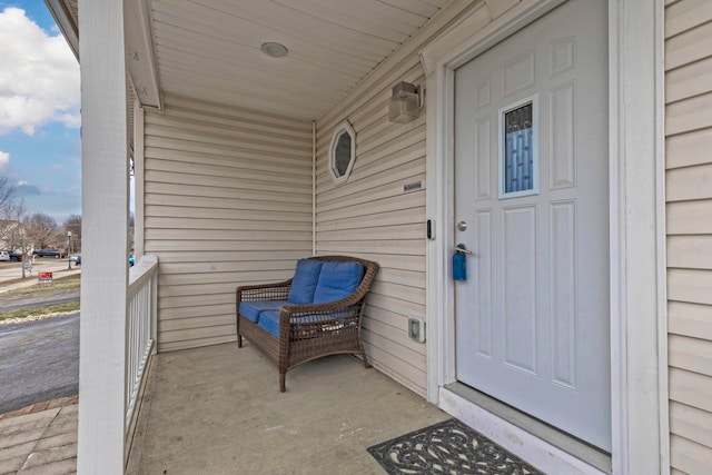 property entrance with covered porch