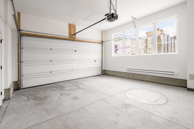 garage featuring a baseboard radiator and a garage door opener