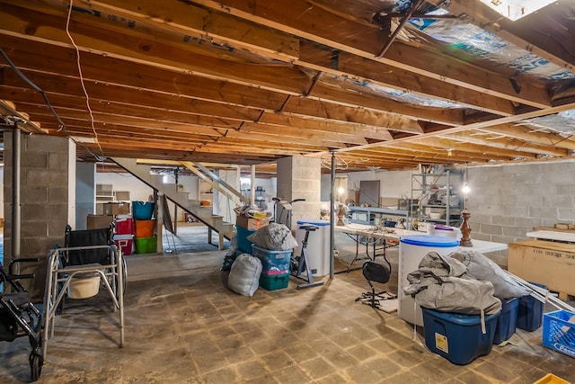 unfinished basement featuring stairs