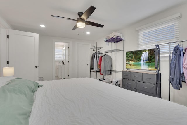 bedroom with ceiling fan, connected bathroom, and recessed lighting