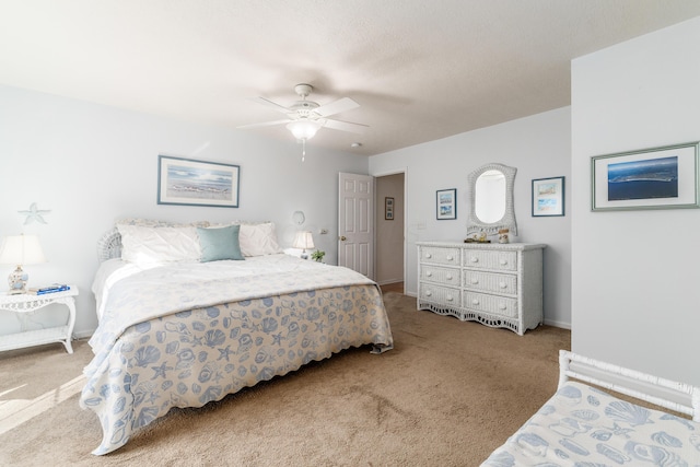 bedroom featuring a ceiling fan, carpet flooring, and baseboards