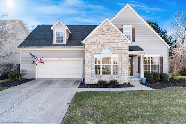 view of front facade with a garage, concrete driveway, roof with shingles, and a front lawn