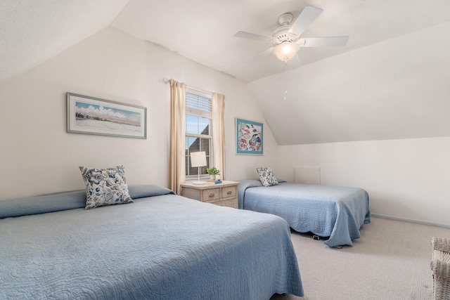 bedroom with vaulted ceiling, carpet, and a ceiling fan