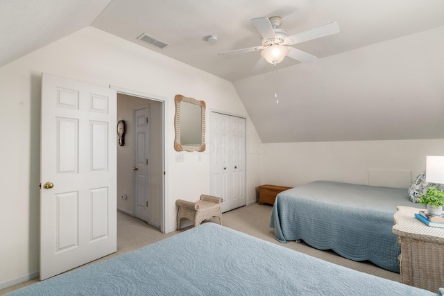 bedroom with lofted ceiling, light carpet, visible vents, and a ceiling fan