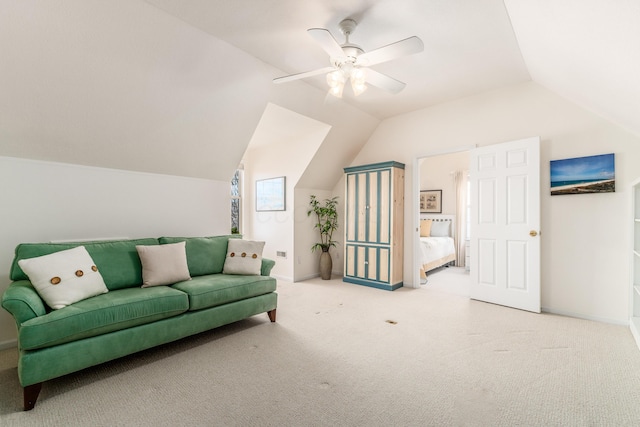 living area with lofted ceiling, carpet flooring, ceiling fan, and baseboards