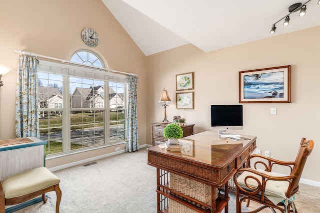 office featuring high vaulted ceiling, carpet flooring, visible vents, baseboards, and rail lighting