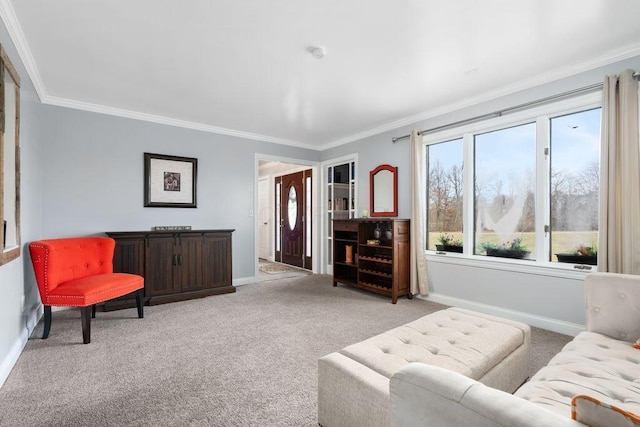 living area with baseboards, ornamental molding, and light colored carpet