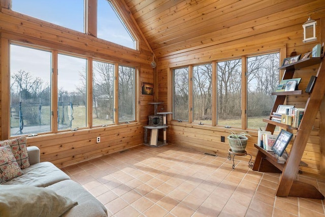 sunroom featuring wooden ceiling and vaulted ceiling