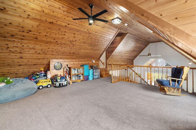 additional living space featuring wooden ceiling, ceiling fan, vaulted ceiling, carpet flooring, and wood walls