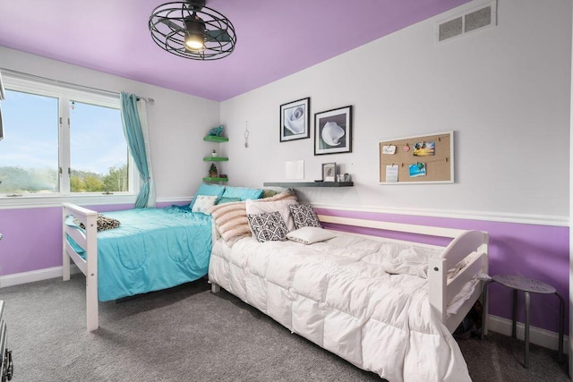 bedroom featuring baseboards, visible vents, and carpet flooring