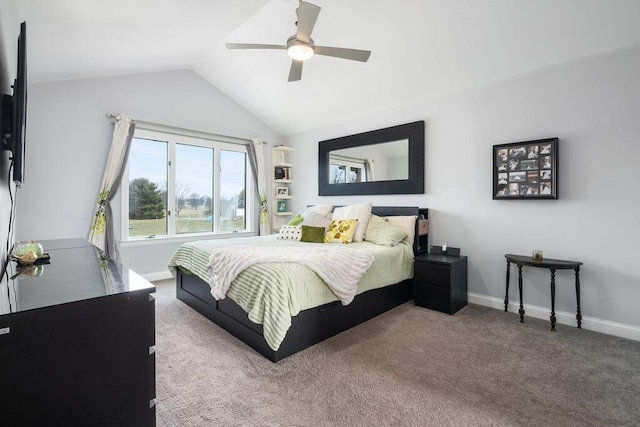 bedroom with vaulted ceiling, carpet floors, a ceiling fan, and baseboards