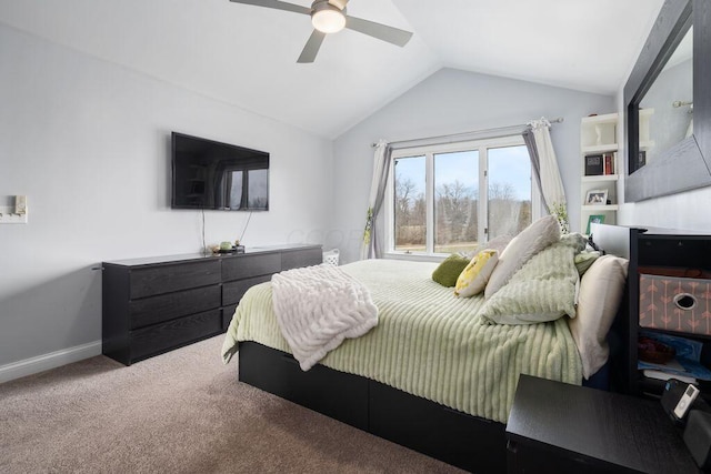 bedroom featuring lofted ceiling, carpet, baseboards, and a ceiling fan