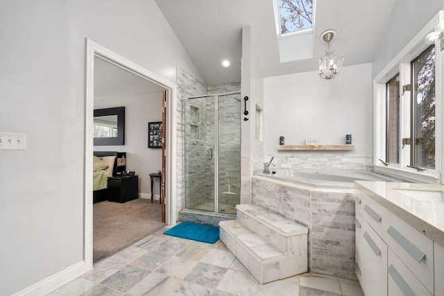 full bathroom with lofted ceiling, ensuite bath, plenty of natural light, and vanity