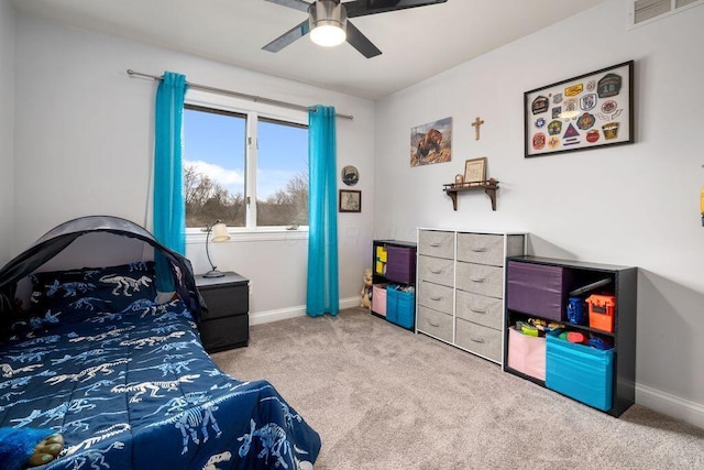 bedroom featuring a ceiling fan, visible vents, light carpet, and baseboards