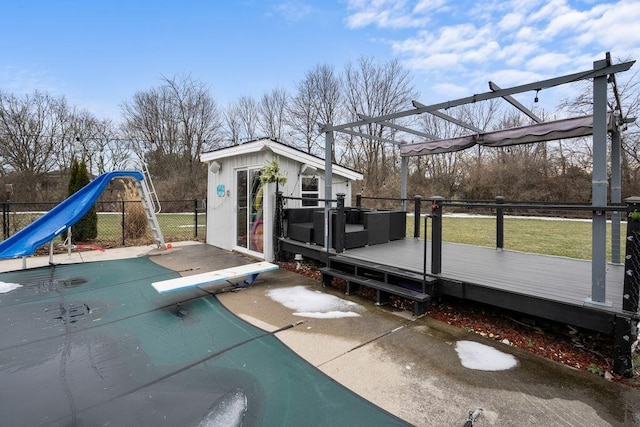 exterior space featuring fence, a deck, and an outdoor structure