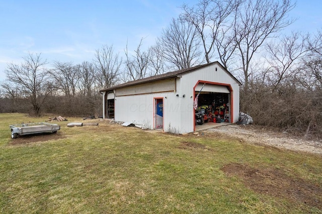 detached garage featuring driveway