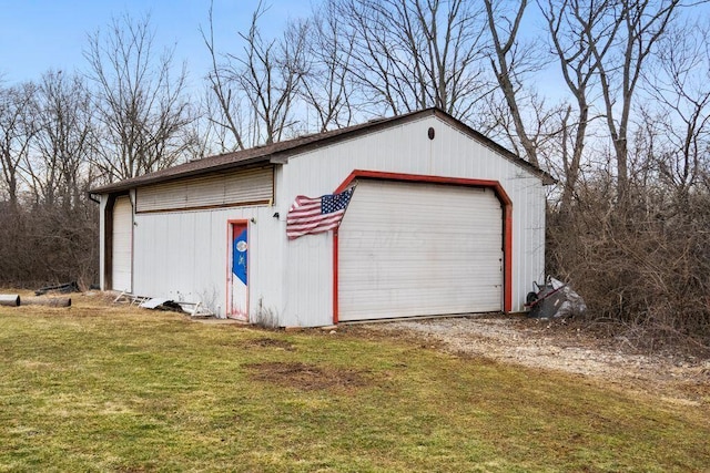 detached garage featuring driveway