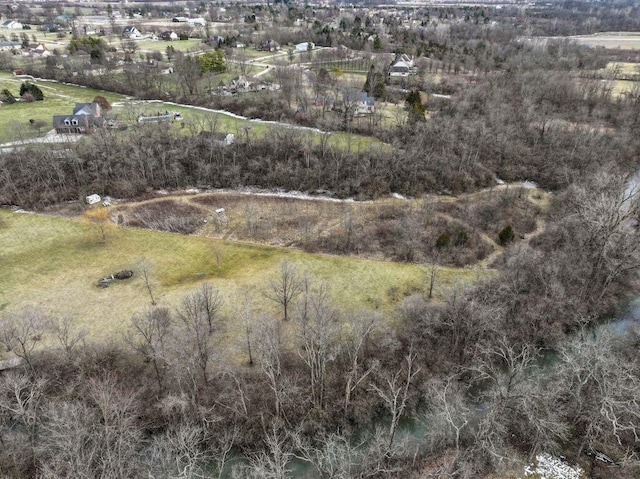 birds eye view of property with a rural view