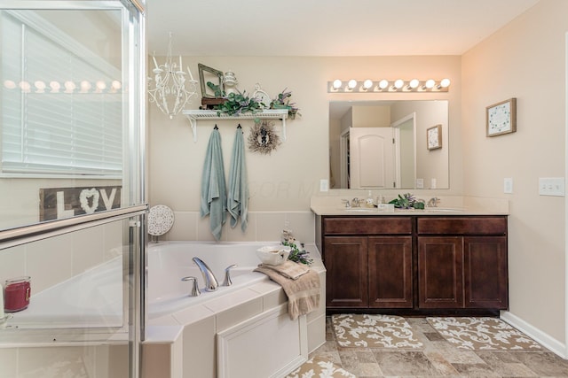 full bathroom with a garden tub, a sink, and double vanity