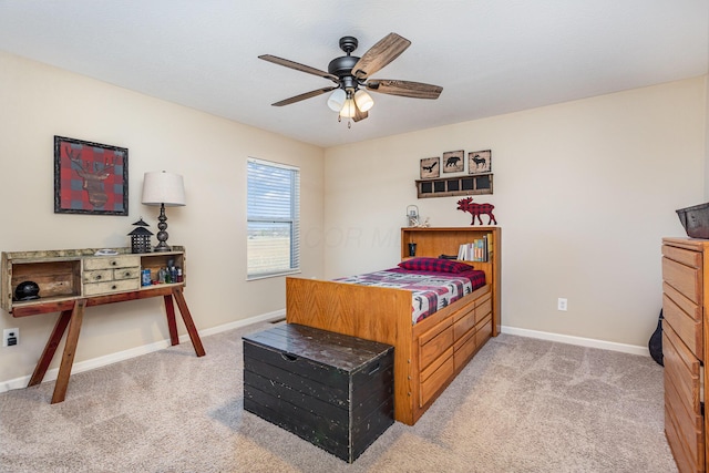 bedroom with ceiling fan, baseboards, and light colored carpet