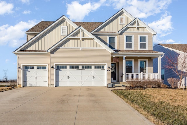 craftsman-style house featuring covered porch, concrete driveway, board and batten siding, and a garage