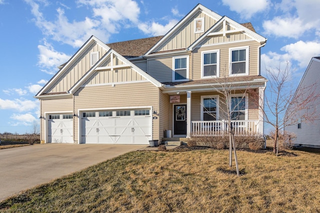 craftsman-style home with covered porch, a garage, concrete driveway, roof with shingles, and board and batten siding